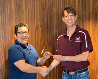 Peter Dill Passes the gavel to Cesar Ayala
